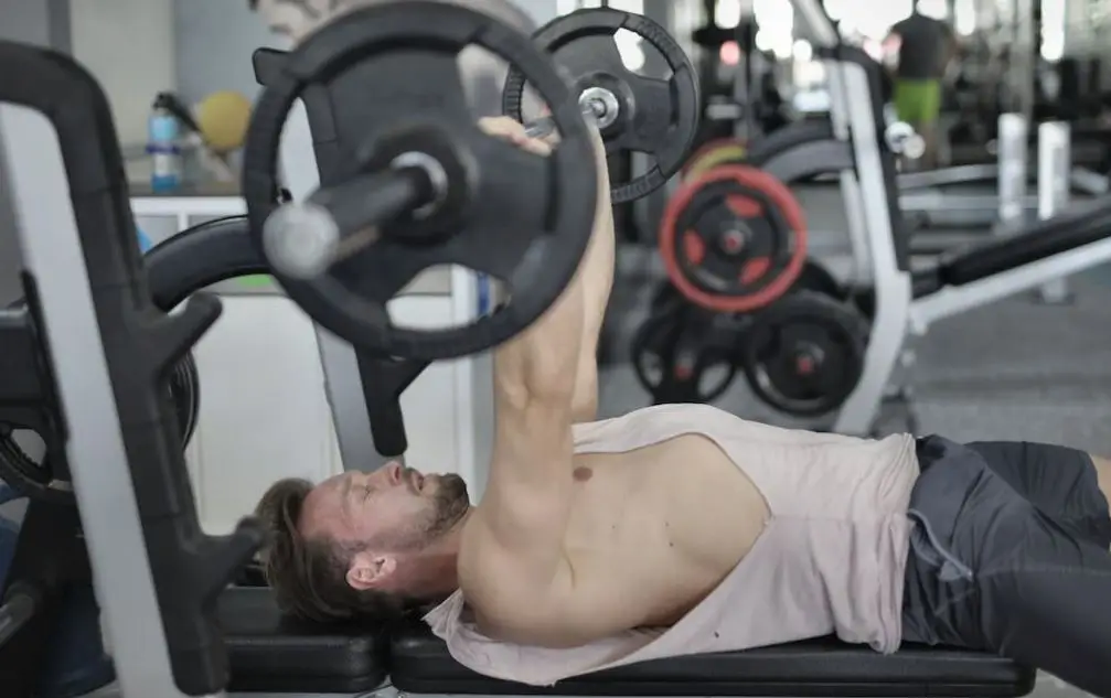 this image shows a person strength training by doing the bench press