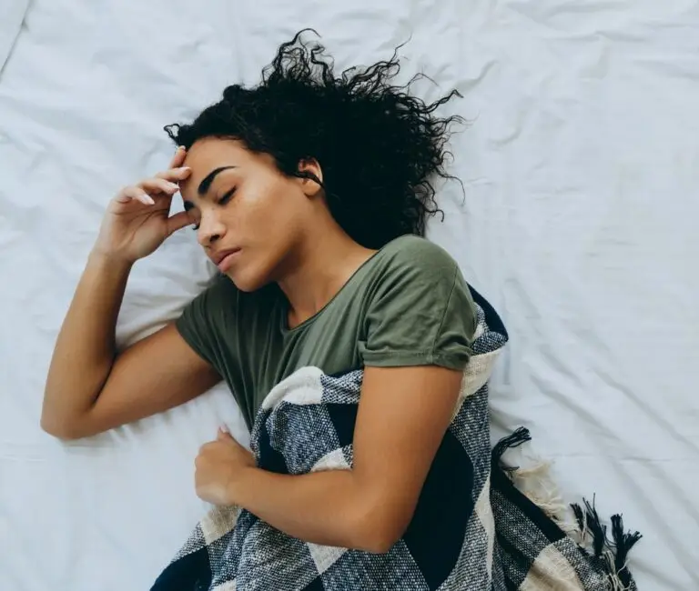 this image shows a person sleeping on their bed