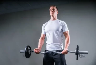 this image shows a person holding a barbell