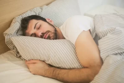 this image shows a person sleeping on the bed