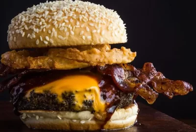 this image shows a greasy bacon burger